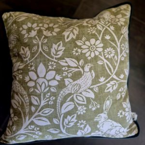 Sage green Pheasant and Hare cushion with bottle green back and piping