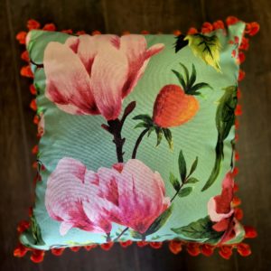 Floral cushion with Burnt Orange herringbone back and pom pom trim