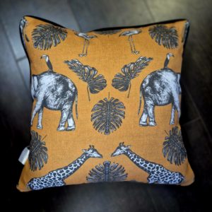 Burnt Orange safari fabric cushion with charcoal piping