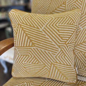 Linwood Sashay Mustard cushions with plain mustard velvet piping
