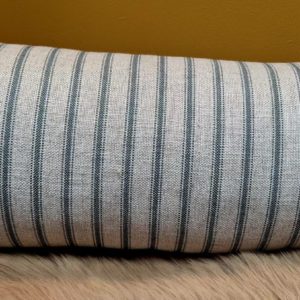 Bolster cushion with frill trim